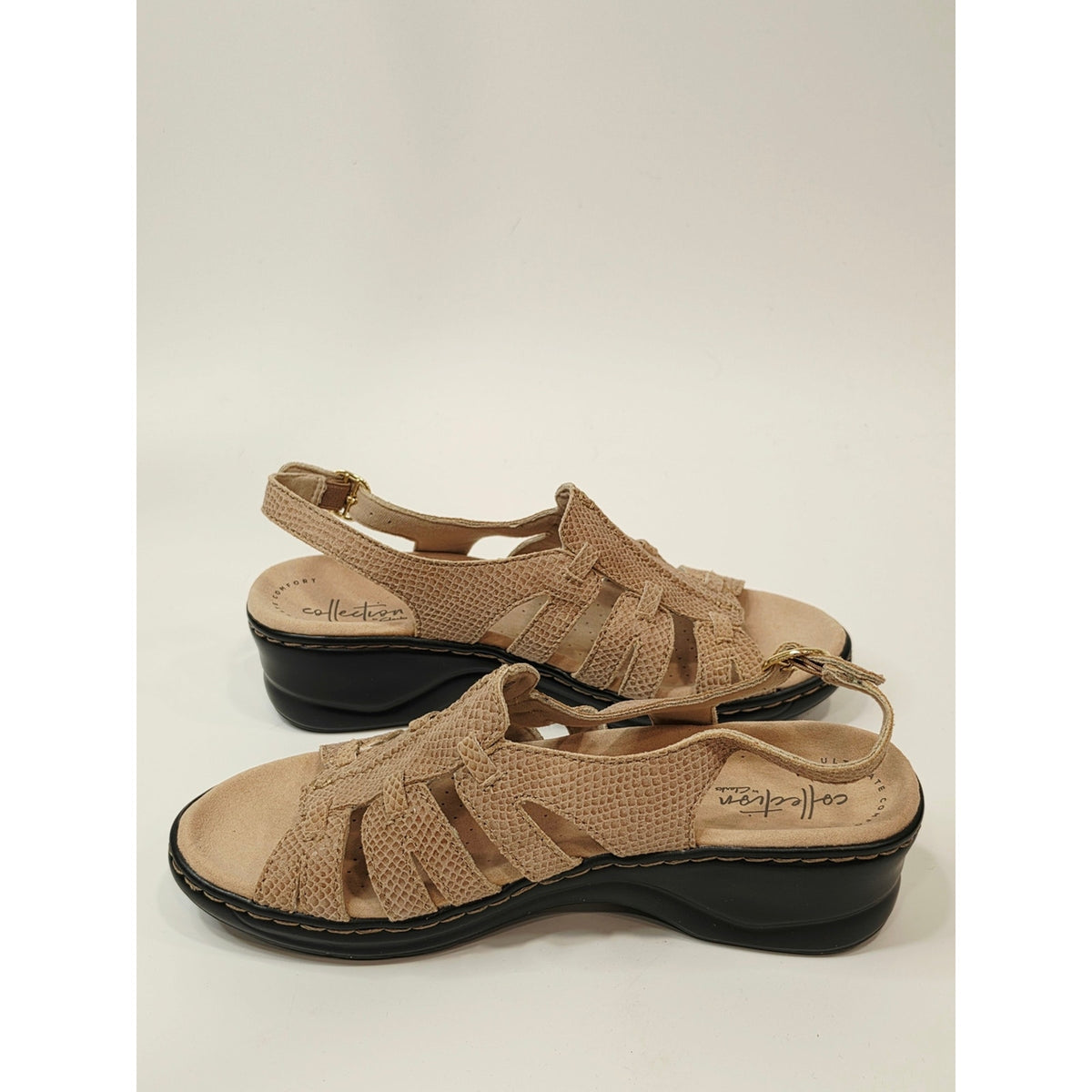 Clarks Lexi Marigold Q Sandals in a beige snake-print leather finish