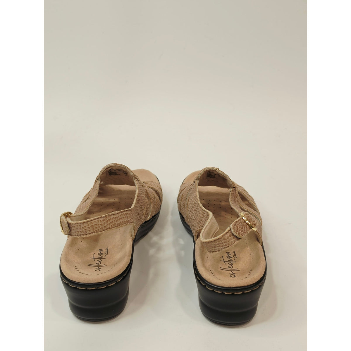 Clarks Lexi Marigold Q Sandals in a beige snake-print leather finish