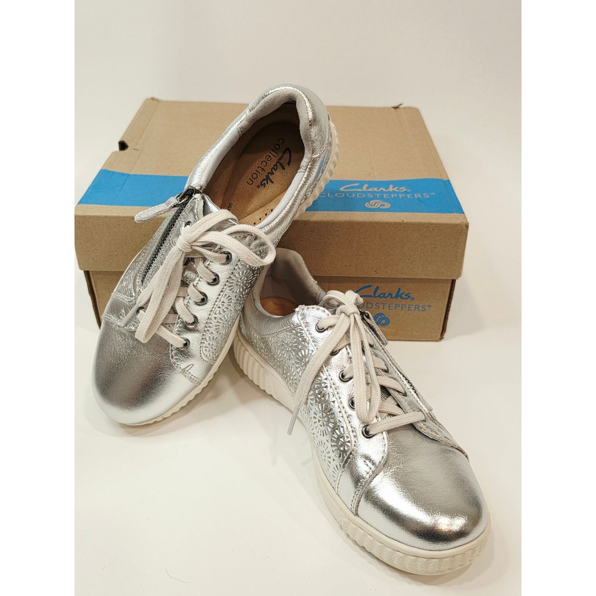 Clarks Collection Caroline Rio leather sneakers in a silver metallic finish
