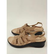 Clarks Lexi Marigold Q Sandals in a beige snake-print leather finish
