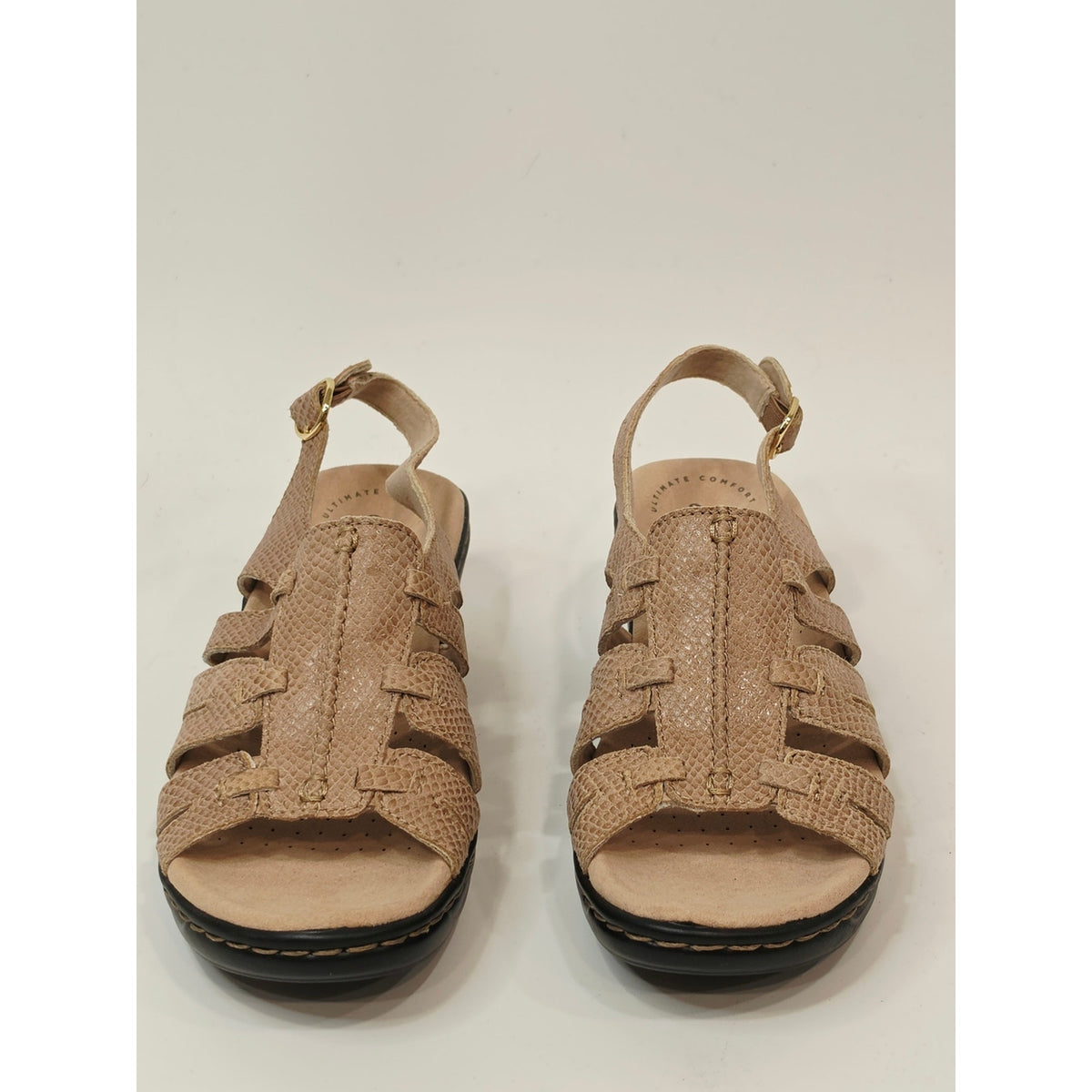 Clarks Lexi Marigold Q Sandals in a beige snake-print leather finish